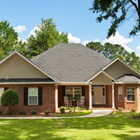 Photo of nice one story brick house in need of insulation services