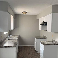 Clean contemporary kitchen remodel done on a budget for apartment building owner